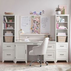 a white desk and chair in front of a bookcase with books on top of it