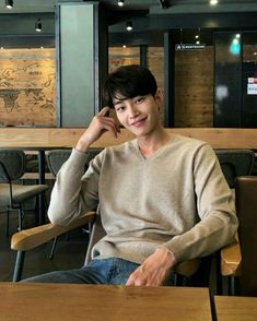 a man sitting at a table in a restaurant