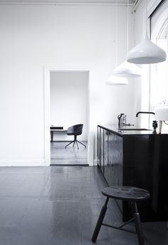 a black and white photo of a kitchen