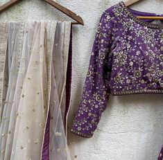 A three-piece aubergine lehenga set from the Priti Sahni collection. This georgette purple butti lehenga with gota work detail is paired with a dull gold blouse with bead and zardozi hand work embroidery. This outfit is completed with a nude dupatta in net material with sequin work. Silver Blouse Work, Purple Pre-draped Saree With Zari Work For Reception, Designer Purple Choli With Gota Work, Designer Purple Lehenga With Sheer Dupatta, Purple Saree With Gota Work For Festive Occasions, Festive Purple Saree With Gota Work, Purple Semi-stitched Pre-draped Saree For Reception, Purple Choli With Sheer Dupatta For Reception, Purple Mirror Work Pre-draped Saree For Wedding