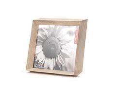 a wooden frame with a sunflower on it