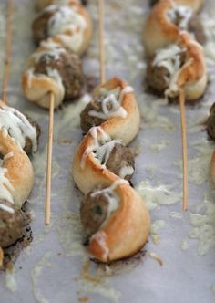 some meatballs are being served with toothpicks