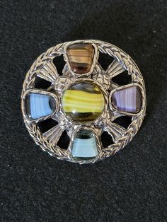 Vintage Scottish Stones White Metal Costume Jewellery Pendant / Brooch 1 3/4 inches Large Centre Stone and 4 smaller stones around Fantastic  Good condition Multicolor Round Brooch Jewelry, Collectible Round Gemstone Brooch, Collectible Round Gemstone Brooches, Multicolor Cabochon Brooches For Collectors, Unique Multicolor Cabochon Brooches, Metal Costume, Jewellery Pendant, Pendant Brooch, White Metal