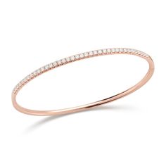 Wrap your wrist in perfection with this delicate diamond bangle bracelet. Effortlessly gorgeous on its own or stacked with other bracelets. -14K gold weighing 9.70 grams -37 round pave-set diamonds totaling 0.95 carats Available in yellow, white, & rose gold. Please allow 4-6 weeks for delivery if item is not in stock. Item no. BR10634 Stackable Diamond Bangle Bracelet, Stackable Diamond Bracelet, Diamond Bangle In Rose Gold With Pave Setting, Rose Gold Diamond Bangle With Pave Setting, Stackable Rose Gold Diamond Bangle, Rose Gold Diamond Stackable Bangle, Flexible Rose Gold Diamond Bracelet, Rose Gold Diamond Bangle With Single Cut Diamonds, Timeless Flexible Diamond Bangle Bracelet