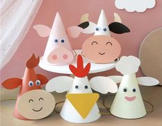 several paper hats with farm animals on them