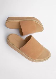 Slide into lasting comfort and style with the Elke slides. Designed with a caramel nubuck upper, a wide rounded open toe front with a contrasting raw wooden platform sole. Pair back with a dress or jeans for a slip-on-and-go essential. -Material: Leather upper, synthetic lining -Colour: Caramel coloured leather nubuck -Features: Platformed sole -Heel height: 4.5cm Thigh High Boots Flat, Embellished Heels, Tony Bianco, Metallic Shoes, Bridal Heels, Bow Heels, Slingback Shoes, How To Stretch Boots, Clear Heels