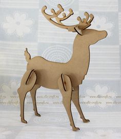 a wooden reindeer standing on top of a table