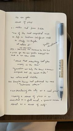 an open notebook with writing on it