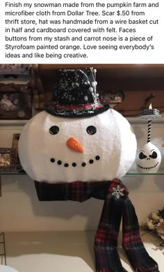 a snowman hat and scarf hanging on a shelf