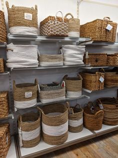 baskets are stacked on shelves in a store