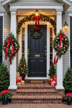 christmas wreaths and decorations adorn the front door of a house decorated for the holidays