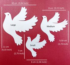 two white doves cut out on a red background, with measurements for each one