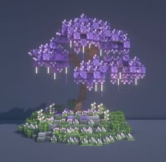 a purple tree with lots of flowers in the ground and lights shining on it's branches