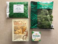 two bags of baby spinach, one bag of pasta and another bag of peas