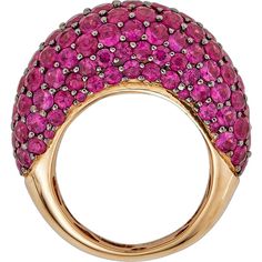 This Dome Ring in Deep Pink Sapphire is a true showstopper, perfect for the woman who wants to make a statement with her jewelry. With approximately 10.50 carats of round Deep Pink Sapphires, this ring is sure to catch the eye and spark conversation wherever it goes. The unique combination of 18K Rose and Black Gold creates a stunning contrast that enhances the beauty of the gemstones and elevates the overall design of the piece.Designed by the renowned jewelry brand Piranesi, this Dome Ring is Luxury Ruby Jewelry With Pave Setting, Luxury Ruby Ring With Vvs Clarity, Luxury Ruby Ring With Pave Setting, Luxury Oval Dome Ring With Pave Setting, Luxury Pink Rings With Pave Setting, Luxury Ruby Diamond Ring With Pave Setting, Luxury Oval Ruby Ring With Pave Setting, Luxury Pink Ruby Ring For Formal Occasions, Ruby Rings With Pave Setting