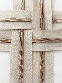 several zippers are shown together on a white surface