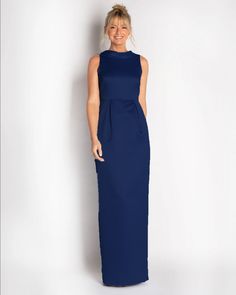 One of our most popular designs for Mother's of the Bride/Groom & Bridesmaids. A classic silhouette made in a luxe satin material with a natural sheen. Rolled collar detail on the front neck drapes down the back to a bra-friendly v. This dress waist line is at natural waist with front box pleats. Silhouette: SheathFit: Can run small due to no stretch (see size guide)Details: Rolled CollarClosure: Invisible ZipperFabric: Non-Stretch SatinCare: Dry Clean OnlyFully Lined: YesBra Friendly: Yes & fea Classic Formal Gown With Pleated Bodice, Classic Gown With Fitted Bodice For Gala, Classic Gown With Fitted Bodice For Formal Occasions, Classic Formal Gown With Fitted Bodice, Elegant Full Length Gown With Pleated Bodice, Fitted Satin Finish Bridesmaid Gown, Satin Maxi Gown With Pleated Back, Elegant Bridesmaid Dress With Satin Finish, Elegant Satin Finish Bridesmaid Evening Dress