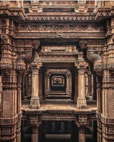 an intricately carved building with columns and pillars