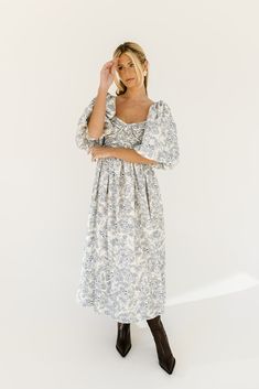 the search for the perfect all-season wedding guest dress is over. this stunning puff sleeve midi dress features a blue floral pattern + a flirty corset-inspired bodice. guaranteed to turn heads with every wear, it’s a must-have for cocktail parties, holiday dinners, or anytime you feel like frolicking. blue floral // midi length, scoop neckline, dramatic puff sleeves, back zipper closure, smocked bodice, fully lined model is 5'8" + wearing a small measurements are approximate + taken while layi Puff Sleeve Midi Dress With Floral Print For Brunch, Brunch Floral Print Midi Dress With Puff Sleeves, Puff Sleeve Floral Midi Dress For Brunch, Blue Floral Print Puff Sleeve Midi Dress, Blue Floral Print Midi Length Puff Sleeve Dress, Blue Floral Print Midi Dress With Puff Sleeves, Blue Fruit, Puff Sleeve Midi Dress, Midi Dress Blue