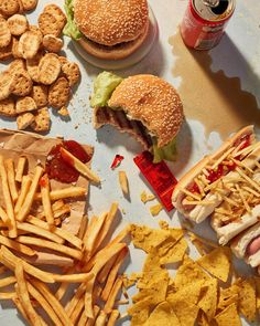 a table topped with lots of different foods and condiments on top of it