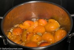 a pot filled with lots of food on top of a stove