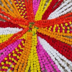 colorful beads arranged in the shape of a flower