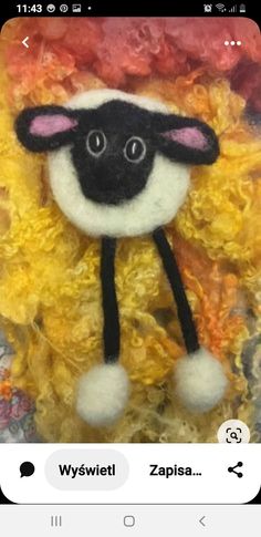 a close up of a stuffed animal made out of yarn