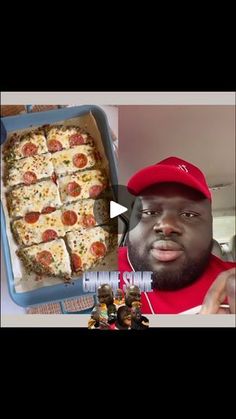 a man with a red hat is looking at a box of pizza and he has his mouth open