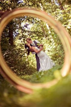 an image of a man and woman kissing in the woods on their wedding day taken from instagram