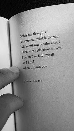 a person holding an open book with the words sorry, thoughs whispered invisible words my mind was a calm chaos filled with reflections of you i wanted to find