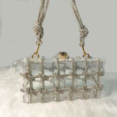 • Fashionable Design :The Rhinestone Purse Hand Bag is a trendy accessory for 2024, perfect for adding a touch of elegance to any outfit. • Versatile Usage :Ideal for parties, this bag offers a versatile and stylish accessory that can enhance your look. • Durable Material :Made from Acrylic, this bag is hard and durable, ensuring long-lasting use. • No Pockets :The interior of this bag is solid without pockets, keeping it simple and chic. • Embellished Decoration :Adorned with diamonds, this bag adds a touch of glamour to your ensemble. • Easy Closure :Featuring a hasp closure, this bag is easy to open and close, ensuring secure storage. Size: Length:20cm(7.87inch) width: 7cm(2.76 inch) Height: 10cm (3.94inch)Manual measurement with 1-3cm errorFabric: Acrylic Tip: Dear buyer friends, our s Glamorous Square Shoulder Bag, Trendy Rhinestone Shoulder Bag For Formal Occasions, Trendy Formal Shoulder Bag With Rhinestones, Trendy Embellished Clutch Bag, Trendy Embellished Rectangular Bag, Glamorous Rectangular Bags, Chic Rectangular Shoulder Bag With Rhinestones, Trendy Rhinestone Clutch Shoulder Bag, Trendy Rectangular Shoulder Bag With Rhinestones