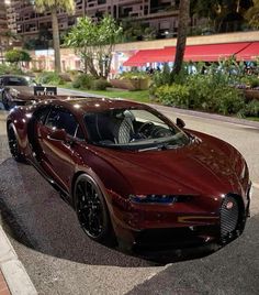 a red sports car is parked on the street