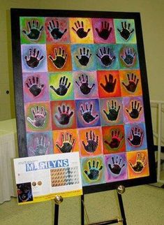 an art display with many hand prints on it