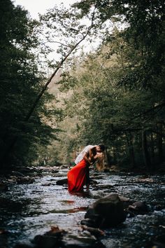 a couple kissing in the middle of a river