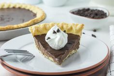 a slice of chocolate pie with whipped cream on top