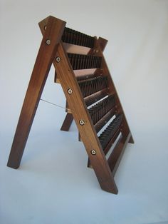 a wooden rack with many different types of items on it's sides and bottom