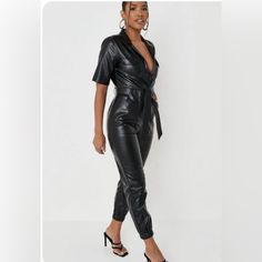 Black Faux Leather. New Fitted Faux Leather Jumpsuits And Rompers For Fall, Fitted Faux Leather Jumpsuits For Fall, Fitted Faux Leather Jumpsuit For Work, Fitted Faux Leather Jumpsuits And Rompers For Party, Black Faux Leather Jumpsuits And Rompers For Night Out, Black Belted Jumpsuits And Rompers For Fall, Faux Leather Jumpsuits And Rompers For Party, Chic Black Faux Leather Jumpsuits And Rompers, Chic Black Faux Leather Jumpsuit