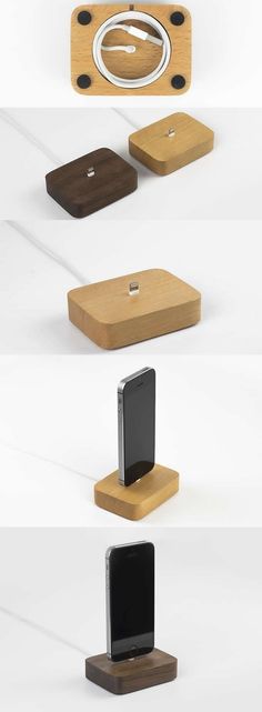 four different types of cell phones on wooden bases with one charging unit attached to the other