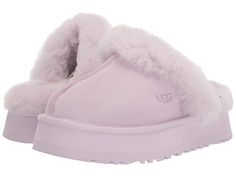 UGG Disquette - Women's Shoes : Lavender Fog : Elevate your comfort game with the UGG Disquette slipper. Premium construction and materials. Secure and comfortable fit. Slip on mule style. Open back. Cushioned footbed. Fur lined. Real, dyed fur from sheep originating from United States, UK, Spain, Ireland, Australia. Suede leather upper. Sheepskin collar, lining, and footbed. Synthetic outsole. Imported. Lavender Uggs, Purple Uggs, Uggs Slippers, Ugg Shoes Women, Descendants Dr, Cute Uggs, Ugg Store, Pretty Sneakers, Disco Style