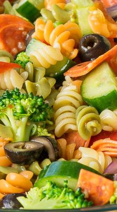 pasta salad with broccoli, carrots, cucumbers and olives