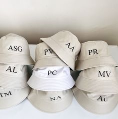 six hats with the letters asg, ppa, av and pc printed on them