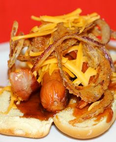 a hot dog covered in cheese and onions on a bun with the words barbecue bacon written above it