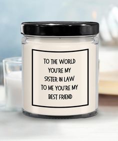 a glass jar with the words to the world you're my sister in law on it