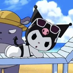 a cartoon character laying on top of a beach next to an animal wearing a hat