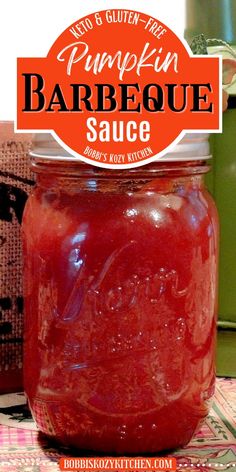 a close up of a jar of barbecue sauce on a table with the words pumpkin barbecue sauce above it