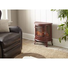 A charm is reminiscent of the wood stoves of the past. The Regal Electric Stove from e-Flame USA delivers a classic front and dancing flame. No need to worry about chimney fires, expensive fuel, and the messy ashes of a real wood stove. With the Regal, you just plug it into any standard household outlet. Equipped with a powerful fan-forced heater, you can reduce your central furnace temperature and cut your heating cost. The Regal flame is enhanced by the realistic matte black finish and subtle Portable Electric Fireplace, Electric Fireplace Stove, Fireplace Stove, Dancing Flame, Stove Fireplace, Electric Stove, Canned Heat, Space Heater, Wood Burning Stove