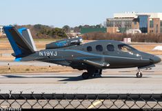 a small plane is parked on the runway