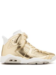 Supplied by a premier sneaker marketplace dealing with unworn, already sold out, in demand rarities. Each product is rigorously inspected by experienced experts guaranteeing authenticity. You're always a winner when you have a pair of Jordans. Crafted from white and gold-tone leather and rubber, these Air Jordan 6 Retro pinnacle from Jordan are sure to make you feel like you've won a first-place medal. Your own trophy. Featuring a round toe, a high ankle, a flat sole, a metallic sheen, a lace fa Luxury Lace-up Basketball Shoes, Gold Sneakers With Air Cushioning For Sports, Luxury Basketball Shoes, Luxury Jordan Lace-up Sports Shoes, Gold Modern Sneakers For Streetwear, Gold Sneakers With Midsole For Streetwear, Luxury Lace-up Jordan Sports Shoes, Modern Gold High-top Sneakers, Sporty Gold Sneakers With Perforations