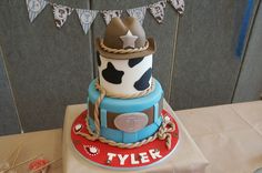 a birthday cake with a cowboy hat on top