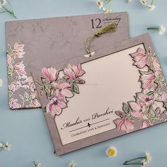 two wedding cards with pink flowers on them